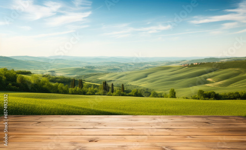 Empty wooden table with green fields background. Table top product display showcase stage. Image ready for montage your text or product.  © Victor