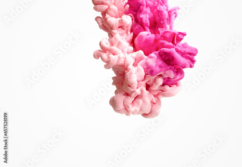 Spill pink paint pigment in water on white background