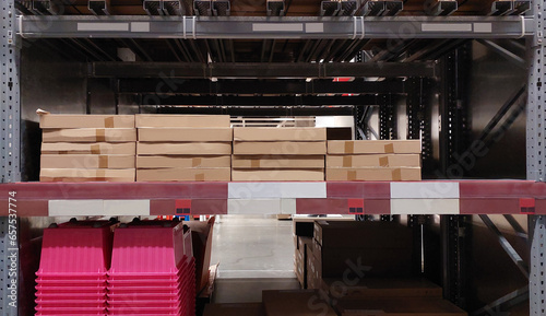Merchandises in warehouse. Steel shelves with goods. Mega store and a bunch of merchandises.