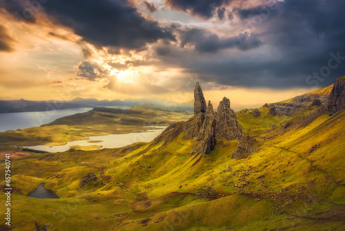 Panoramic view from above of The Old Man of Storr at sunrise. View over Old Man Of Storr during a beautiful sunrise and dramatic sky. Isle of Skye, Trotternish, Scotland, UK photo