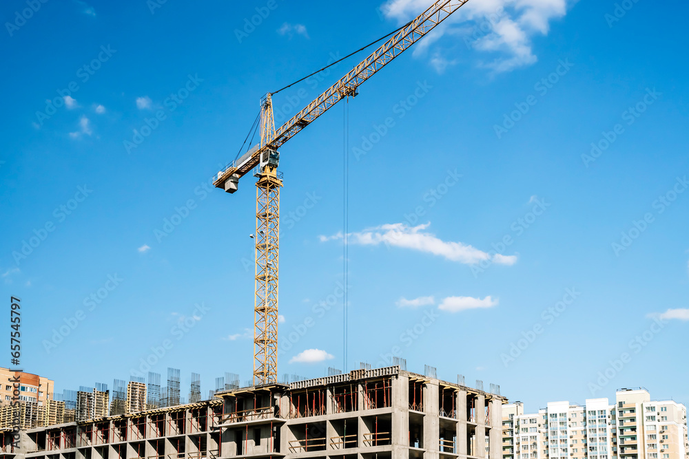 Construction industry building. Construction industry site with cranes, fittings and concrete.