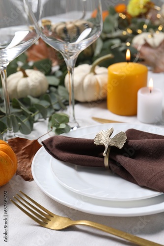 Beautiful autumn table setting with floral decor
