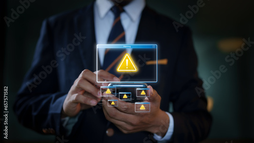 Businessman using a smartphone with a sign warning of online crime risks. Accessing websites, clicking on unsafe text links is a threat to identity theft software.