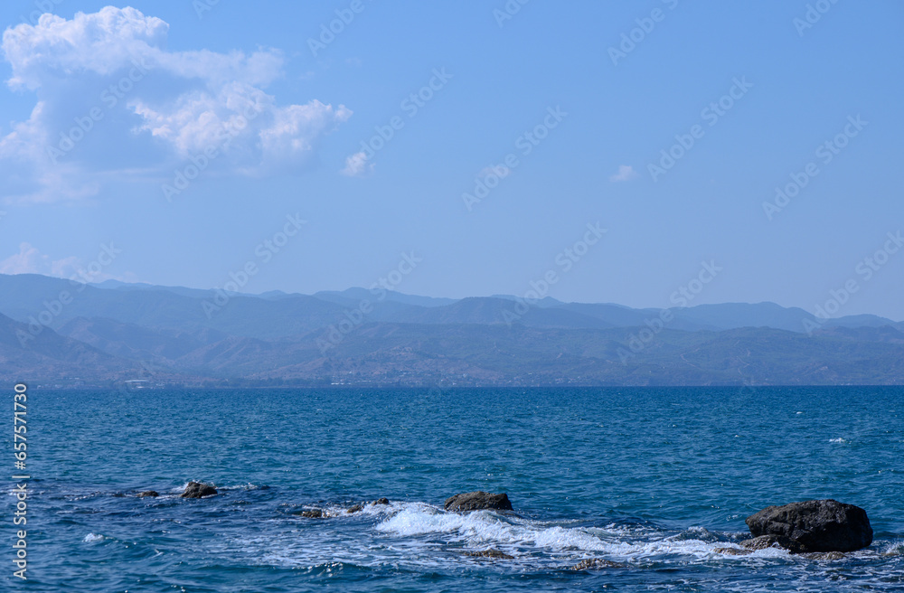 view of the Cyprus mountains from the beach across the sea 1