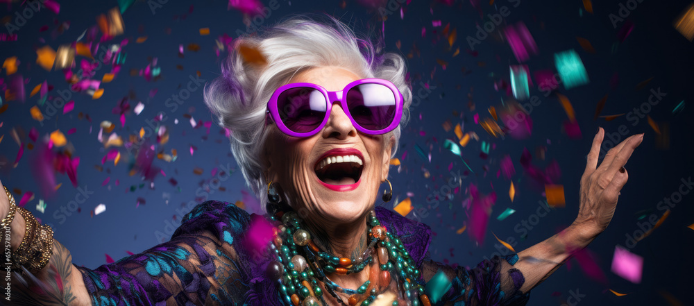 Old lady Surprised and excited, opening eyes and mouth in outrageous party clothing and bright sunglasses, Bright solid orange and purple color background