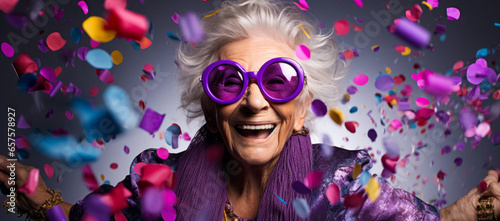 Old lady Surprised and excited, opening eyes and mouth in outrageous party clothing and bright sunglasses, Bright solid orange and purple color background
