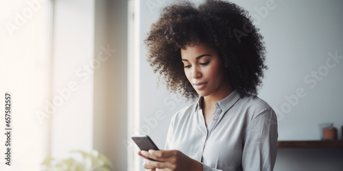  Beautiful black woman scrolling on her phone in her cozy home