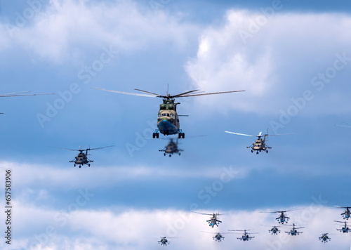 MOSCOW, RUSSIA - MAY 7, 2021: Avia parade in Moscow. Mi-26 and Mi-8AMTK helicopters fly in the sky on parade of Victory in World War II in Moscow, Russia