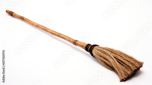  a broom with a long wooden handle on a white background.  generative ai © Anna