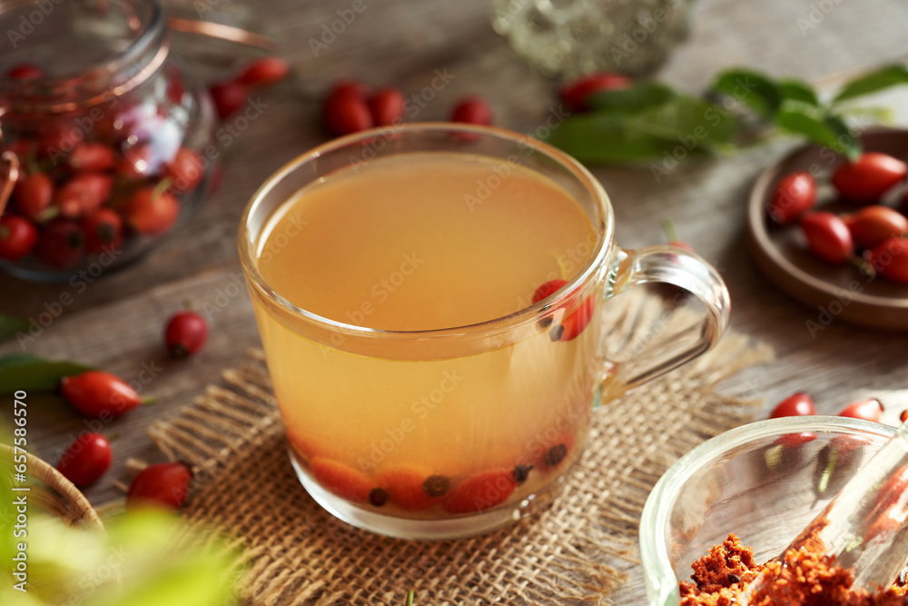 A cup of rose hip tea with fresh berries A cup of rose hip tea with fresh berries