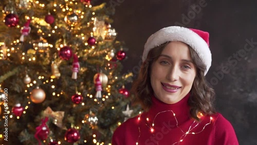 woman calls her friends via video conference call wishing Merry Christmas