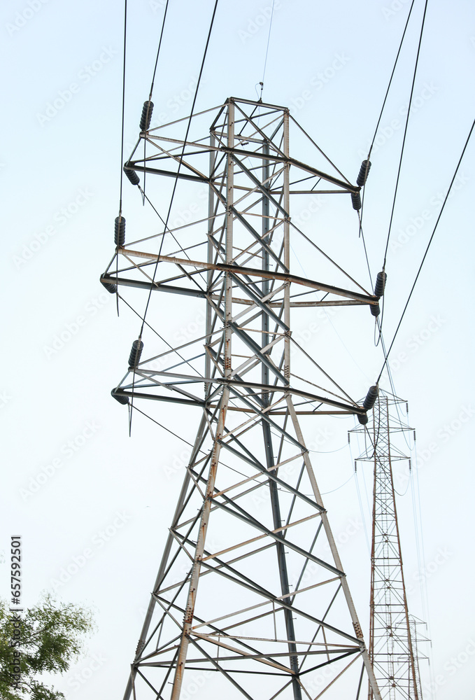 electricity transmission towers against a dramatic sky, symbolizing energy, connectivity, and technological progress electricity transmission towers against a dramatic sky, symbolizing energy, connectivity, and technological progress