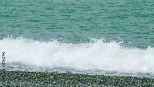 Coastal Seascape Ocean Water With Raging Stormy Sea Waves. Clear Blue Sea Waves Breaking. Slow motion. photo