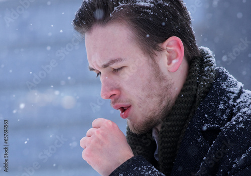 Fotografija Young handsome businessman, sick unhealthy man cough outdoors at winter cold day