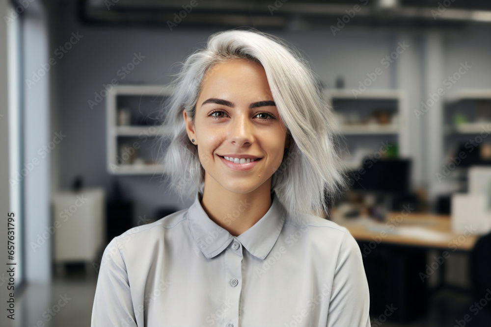 portrait of young woman with dyed silver blond hair in office portrait of young woman with dyed silver blond hair in office