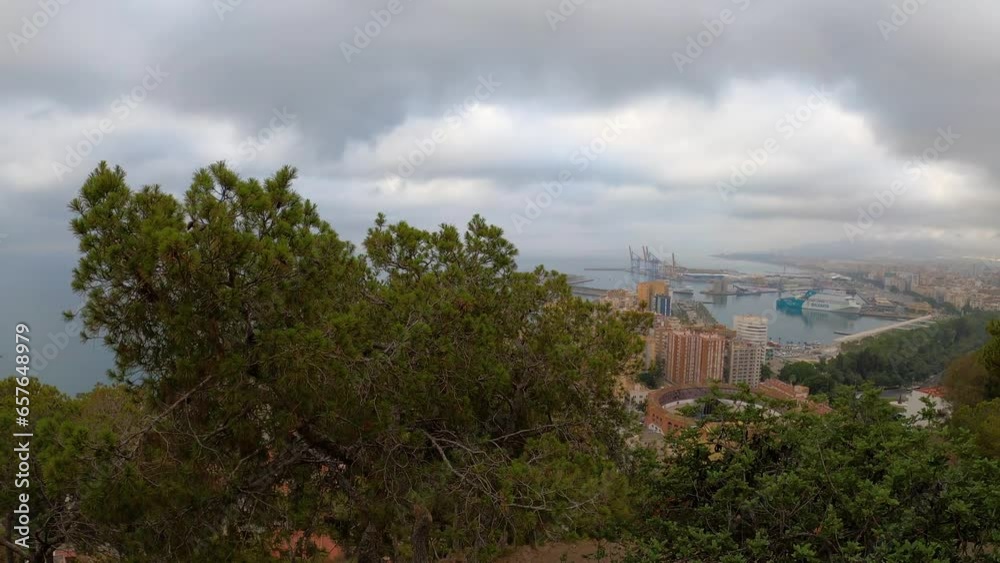 Panoramic aerial view of Malaga in a cloudy summer day in the morning in Malaga, Spain Panoramic aerial view of Malaga in a cloudy summer day in the morning in Malaga, Spain