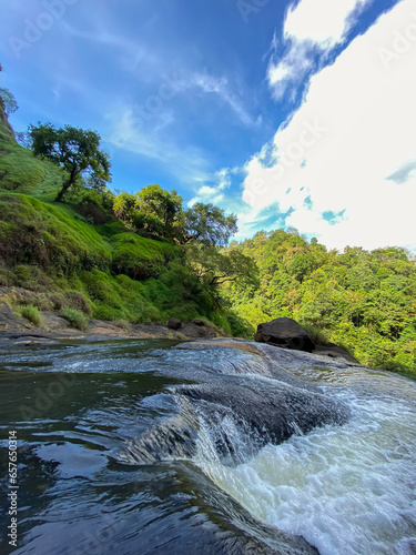 Sodong Waterfall located in Ciwaru Village, Ciemas District, Sukabumi Regency. One of several waterfalls which is a mainstay destination in the Ciletuh Unesco Unesco Global Geopark (CPUGGp). photo