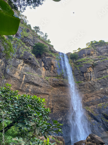 Sodong Waterfall located in Ciwaru Village, Ciemas District, Sukabumi Regency. One of several waterfalls which is a mainstay destination in the Ciletuh Unesco Unesco Global Geopark (CPUGGp).  photo