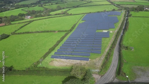 Kingsbridge, South Devon, England: DRONE VIEWS: The drone tracks l-to-r above a solar panel farm field for generating electricity. Kingsbridge is a market town and tourist hub in the South Hams area.