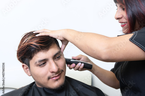 Female Hairdresser Working with Male Client At Orange Meches Balayage And Haircut In A Hairdresser Salon.JPG