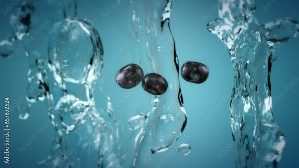 Fruit and berries tossed in the air and falling down in slow motion. Clear water splash and water droplets. Fresh natural blueberries in the air with water splash falling down Fruit and berries tossed in the air and falling down in slow motion. Clear water splash and water droplets. Fresh natural blueberries in the air with water splash falling down