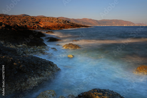 Morning Sunlight and splashing waves near Sissi, Crete, Greece.