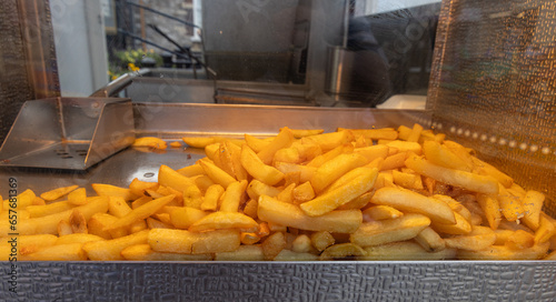 British chips on sale in traditional fish and chip shop, United Kingdom