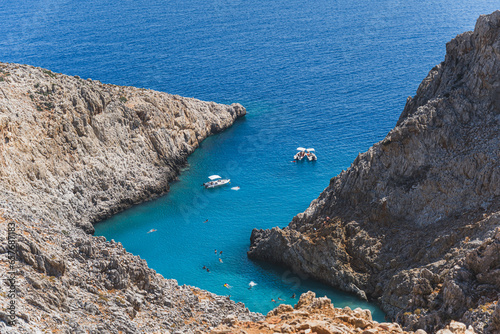 Magical view above Seitan Limania beach with tourists enjoying their day, Crete, Greece. High quality photo photo