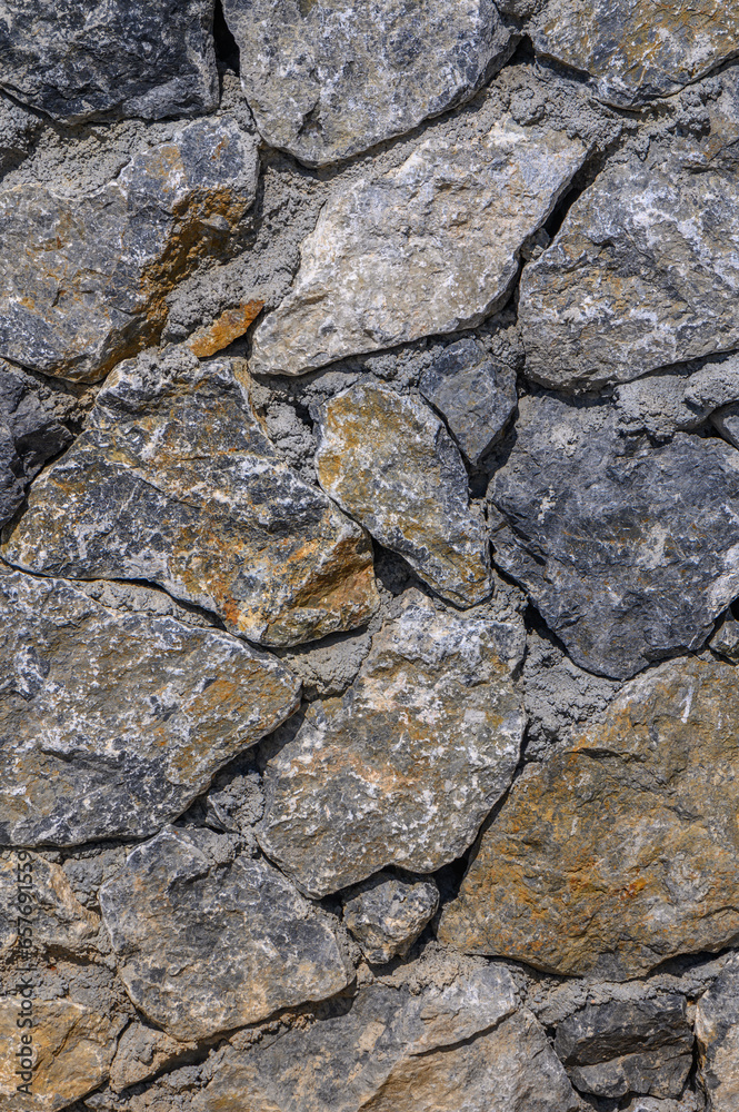 old natural stone wall as background 