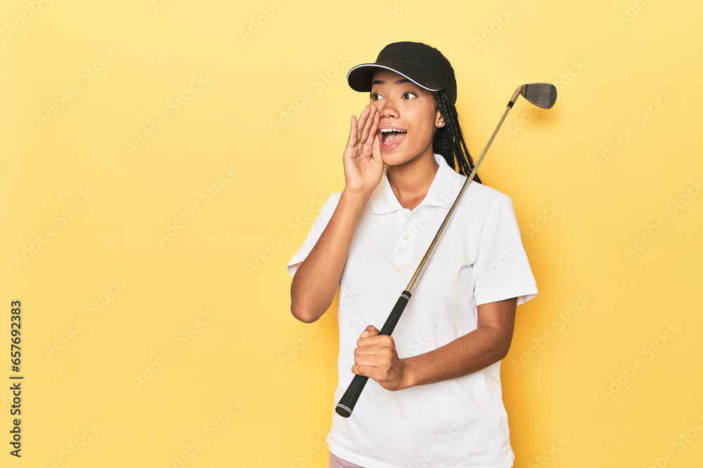 Indonesian female golfer on yellow backdrop shouting and holding palm near opened mouth. Indonesian female golfer on yellow backdrop shouting and holding palm near opened mouth.