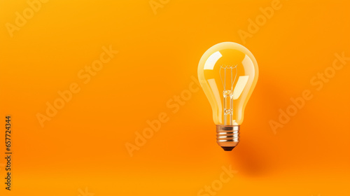 Light bulb on orange background. Ultra-high quality