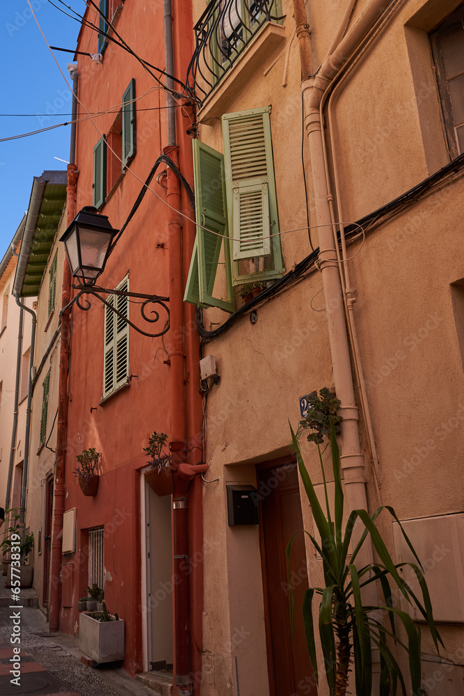 Menton, France – August 8, 2023 - narrow streets in Menton old town on a beautiful summer day