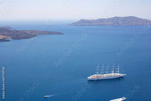 Big ferry boat sailing across the bay in Santorini, Greece