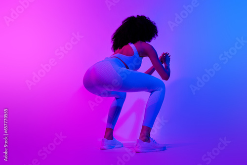 Full body photo of motivation sportive girl sitting model strong legs powerful slimming workout sit ups isolated on neon filter background