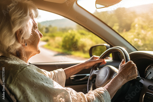 concentrated elderly woman confidently driving a car