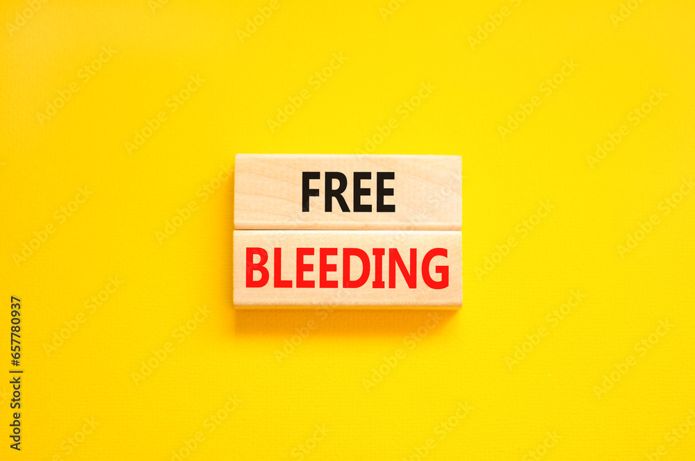 Free bleeding symbol. Concept words Free bleeding on beautiful wooden block. Beautiful yellow table yellow background. Gen Z, motivational, freedom free bleeding concept. Copy space. Free bleeding symbol. Concept words Free bleeding on beautiful wooden block. Beautiful yellow table yellow background. Gen Z, motivational, freedom free bleeding concept. Copy space.
