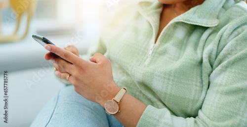 Home, closeup and woman with a cellphone, typing and connection with social media, relax and network. Person, apartment or girl with a smartphone, mobile user and contact with digital app or internet © Charlize Davids/peopleimages.com