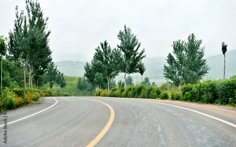 Winding road through a low mountain Winding road through a low mountain