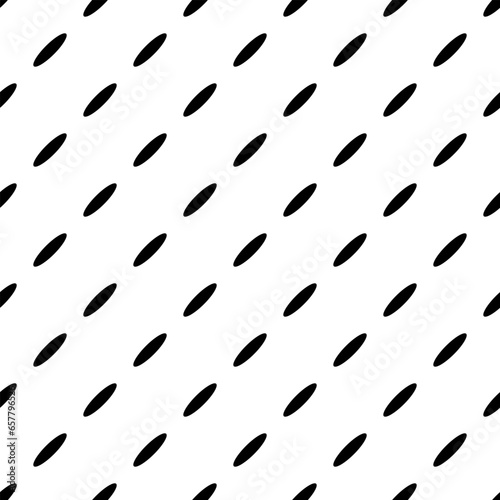 Abstract seamless pattern with black dotted diagonal lines from ovals