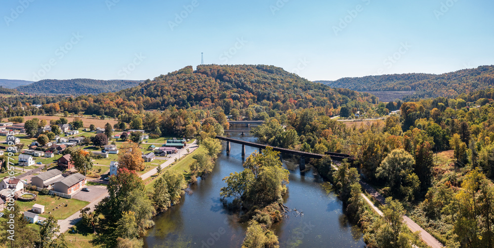 Aerial panorama of the small town of Confluence in Somerset County in Pennsylvania with fall colors on the leaves and trees