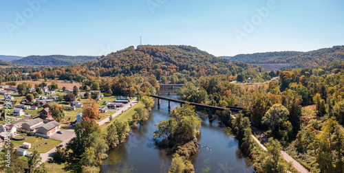 Aerial panorama of the small town of Confluence in Somerset County in Pennsylvania with fall colors on the leaves and trees photo