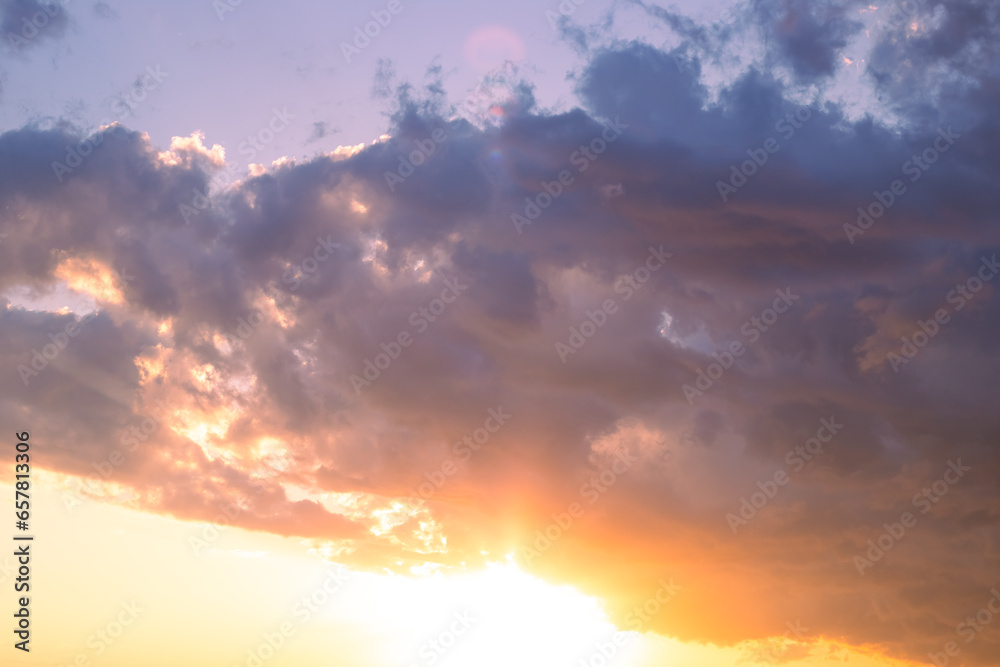 bright cloudy sky at sunset on an autumn evening. Cloud landscape. Background for text