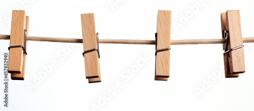 Wooden pegs on a rope holding nothing photo