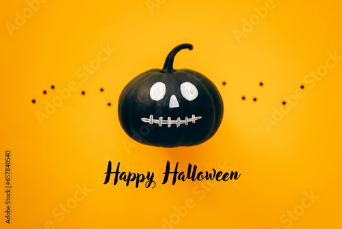 Black Jack o Lantern bumkin on orange background. Halloween invitation card