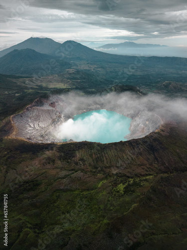 Java's Volcanic Gem: Aerial View of Mount Ijen and the World's Largest Highly Acidic Lake. Embark on a Natural Adventure in Indonesia, Asia's Premier Vacation Destination