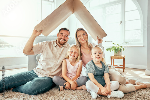 Happy family, portrait and cardboard roof for real estate, moving in or property investment at new home. Mother, father and kids smile for shelter, apartment or relocation together on house mortgage