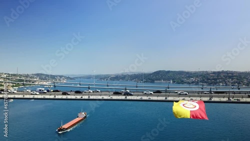 GS Flag in yellow and red colors attached to the Bosphorus Bridge to celebrate the league championship of the Galatasaray Football Team. Istanbul, Turkey
