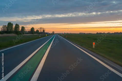 View from Driving Car at Sunset, Netherlands
