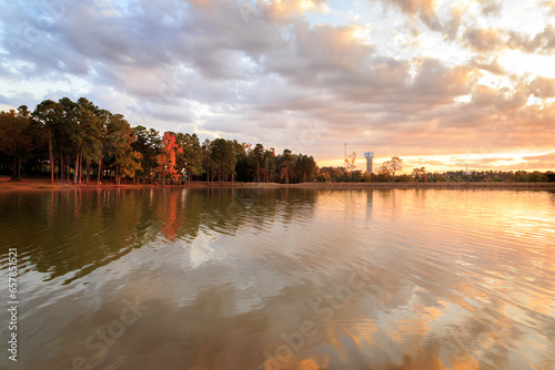 Autumn Sunset At The Longview Water Tower with a lake and sunset clouds photo