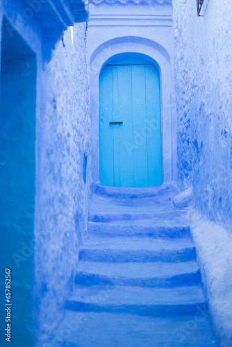 Blue door in the blue Arabic city Chefchaouene in Marocco © Lara